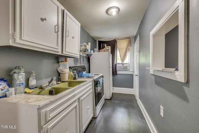 kitchen featuring baseboards, a sink, light countertops, electric stove, and white cabinetry