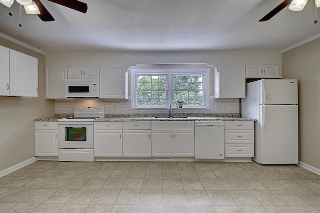 kitchen with sink, white appliances, decorative backsplash, and white cabinets