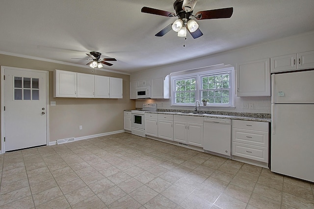 kitchen featuring white cabinetry, white appliances, sink, and decorative backsplash