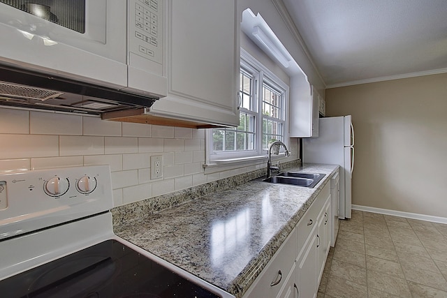 kitchen with sink, white appliances, tasteful backsplash, ornamental molding, and white cabinets