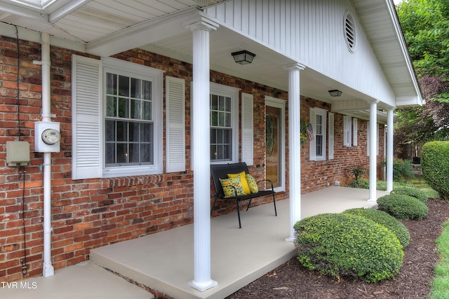 view of exterior entry featuring a porch