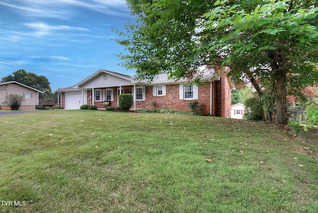 ranch-style house with a garage and a front lawn