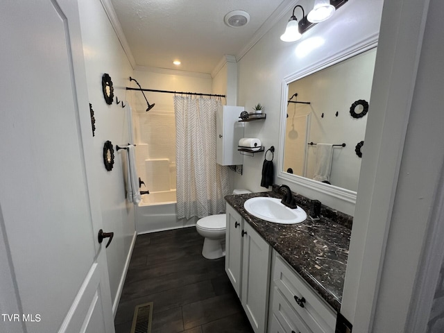 full bathroom with crown molding, hardwood / wood-style floors, oversized vanity, shower / bath combo with shower curtain, and toilet