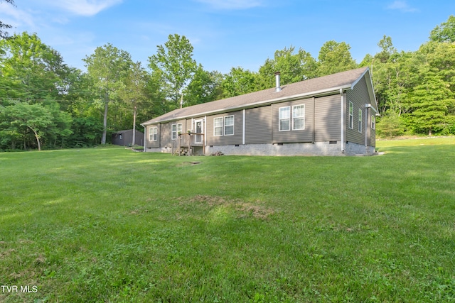 back of house featuring a yard