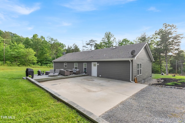 exterior space with outdoor lounge area, a patio area, and a yard