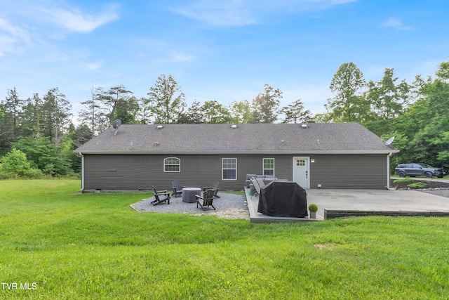 rear view of house with a patio area and a yard