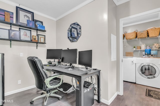 office space featuring ornamental molding, dark wood-type flooring, and washer / dryer