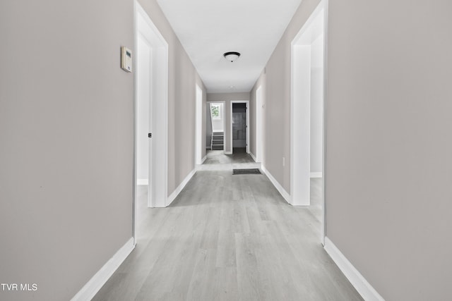 hall with light hardwood / wood-style flooring