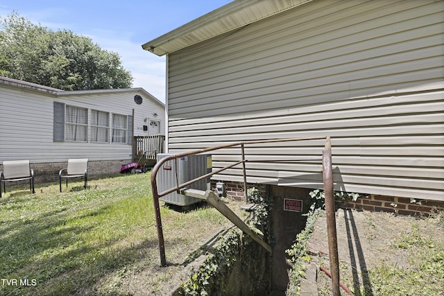 view of yard with central air condition unit