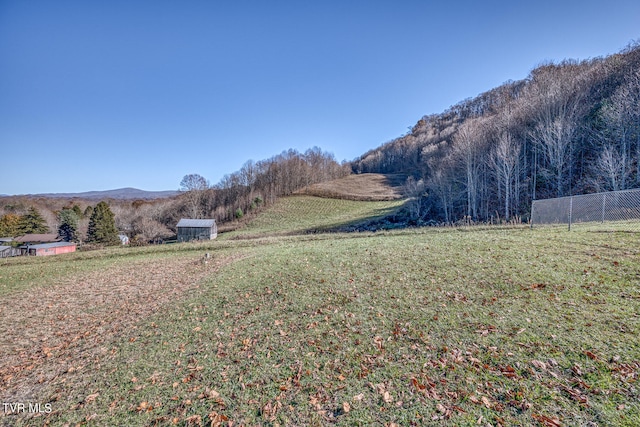 view of yard with a rural view