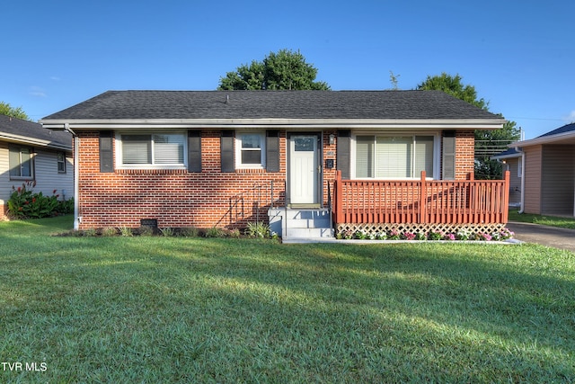 view of front of property with a wooden deck and a front lawn