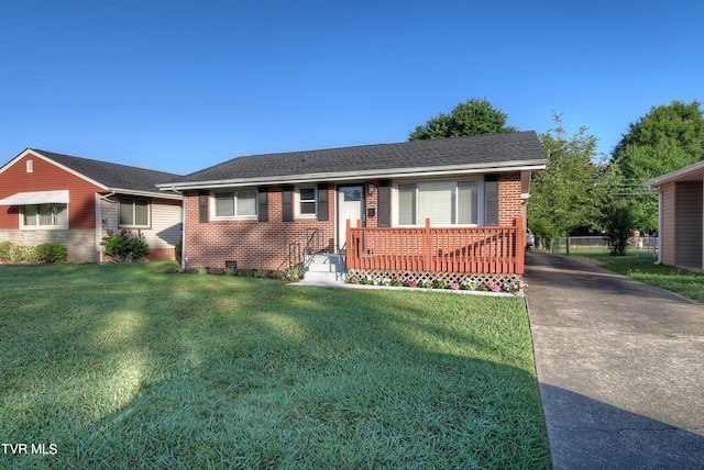 ranch-style home featuring a front yard