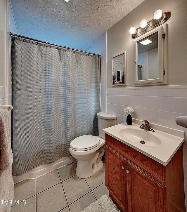 bathroom featuring toilet, a textured ceiling, tasteful backsplash, and tile walls