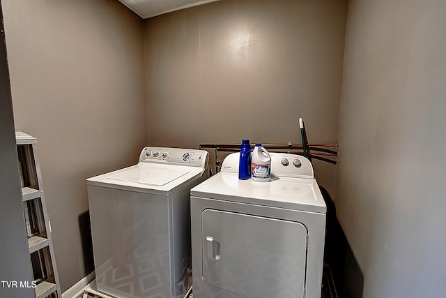 laundry room featuring separate washer and dryer