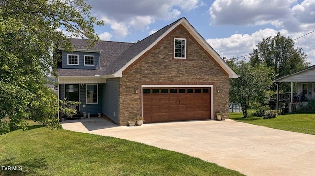 view of front of property with a front yard and a garage