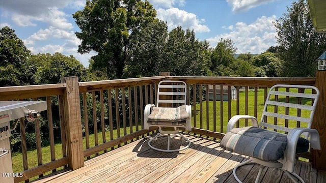 wooden deck with a yard