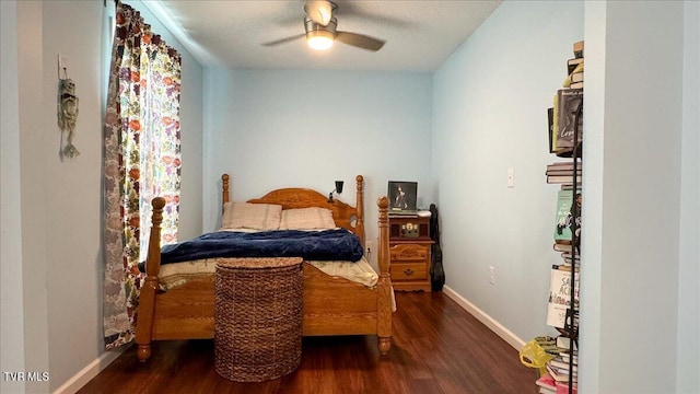 bedroom featuring ceiling fan, dark wood-type flooring, and a textured ceiling