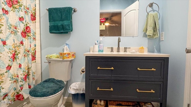 bathroom featuring vanity and toilet