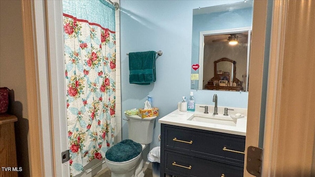 bathroom with vanity, a shower with curtain, and toilet