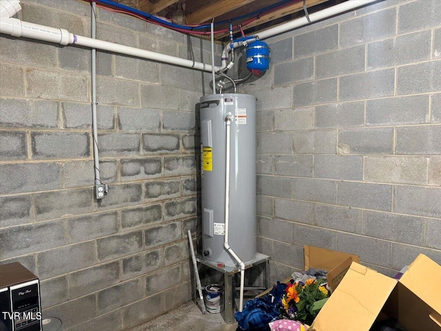 utility room featuring water heater