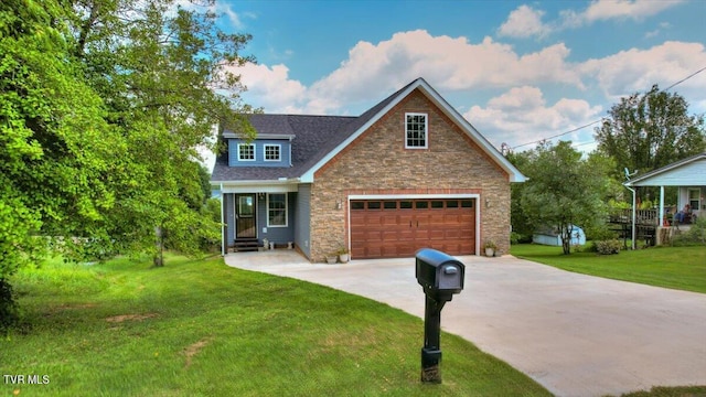 view of front of house with a garage and a front yard