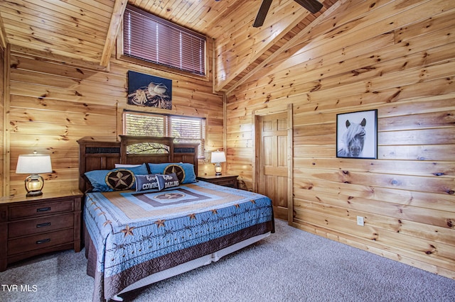 carpeted bedroom with wood walls, high vaulted ceiling, ceiling fan, beamed ceiling, and wood ceiling