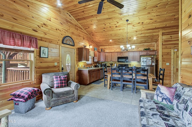 living room featuring wooden walls, high vaulted ceiling, wooden ceiling, and light tile patterned flooring