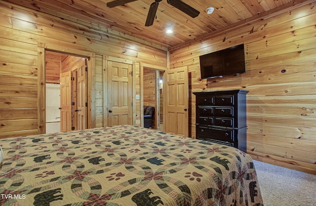 bedroom featuring wooden walls, carpet floors, wood ceiling, and ceiling fan