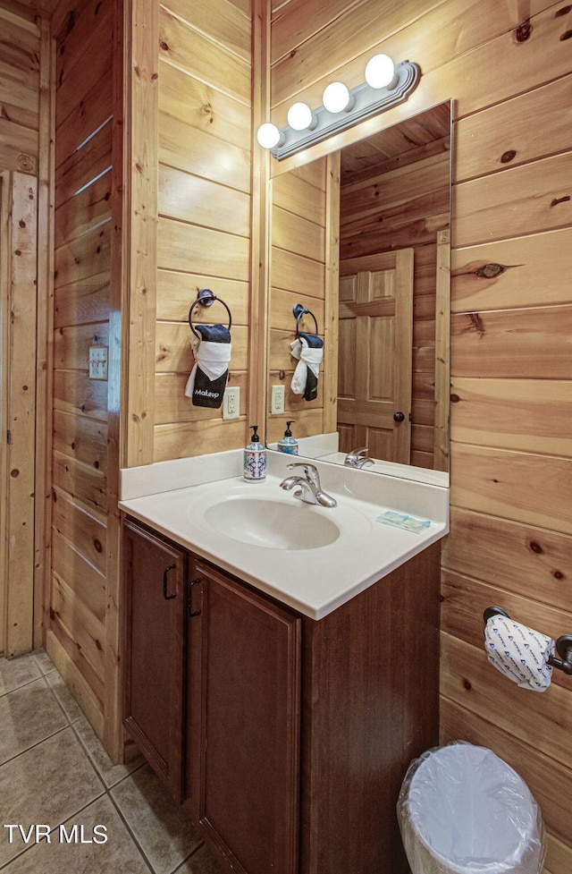 bathroom featuring vanity and wood walls