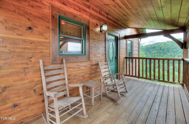 wooden terrace featuring covered porch