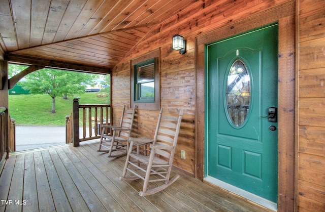 view of exterior entry featuring a porch