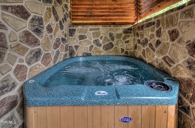 exterior details featuring a jacuzzi