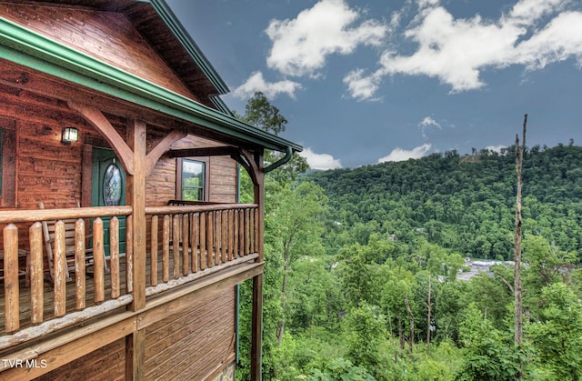 view of side of property featuring a balcony