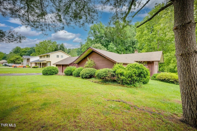 view of front of home with a front lawn