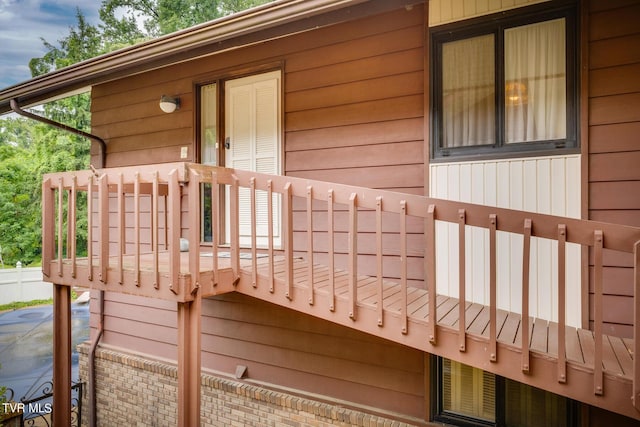 view of side of property with a balcony