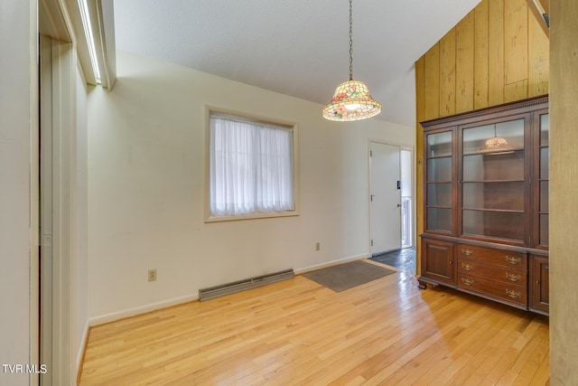 interior space featuring light hardwood / wood-style floors and baseboard heating