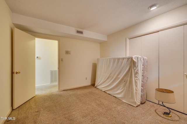 unfurnished room featuring light colored carpet