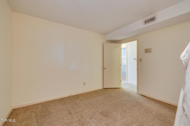 empty room featuring light colored carpet