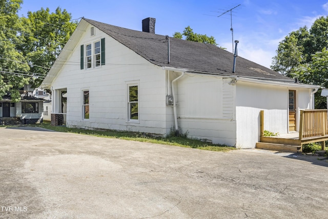 view of home's exterior featuring a deck