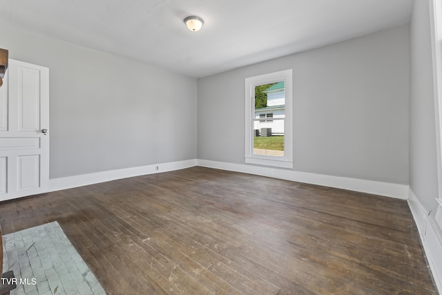 empty room featuring dark hardwood / wood-style floors