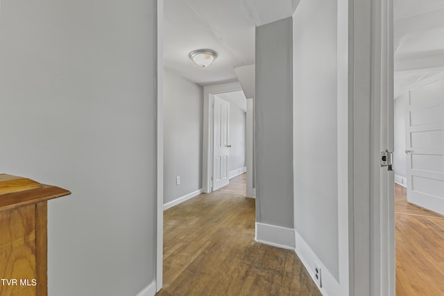 corridor featuring wood-type flooring