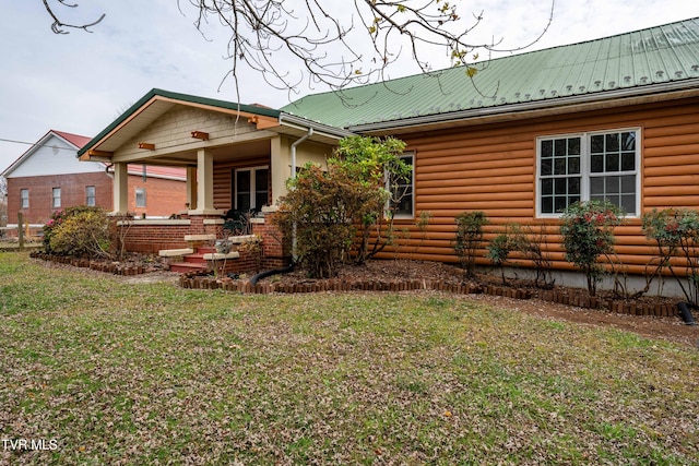 view of front of property with a front lawn and a porch