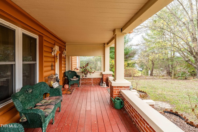 wooden deck featuring covered porch