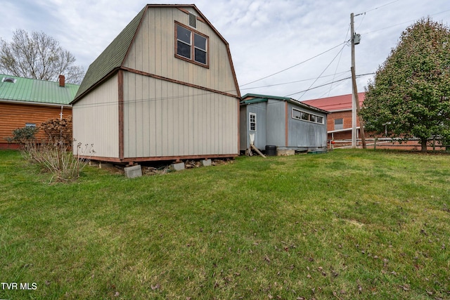 back of house with a lawn