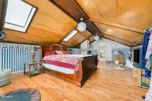 bedroom with hardwood / wood-style floors, wood ceiling, and vaulted ceiling with skylight