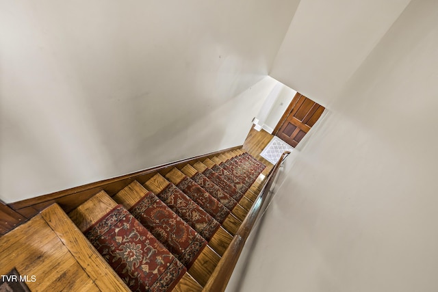 staircase featuring hardwood / wood-style floors