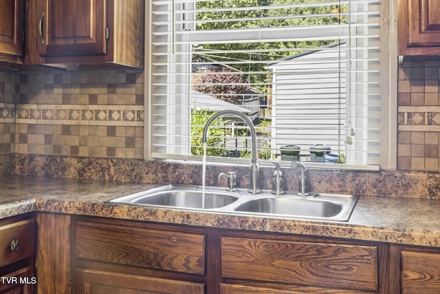 kitchen with a wealth of natural light and sink