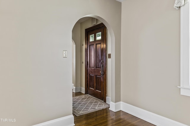 foyer entrance with dark wood-type flooring