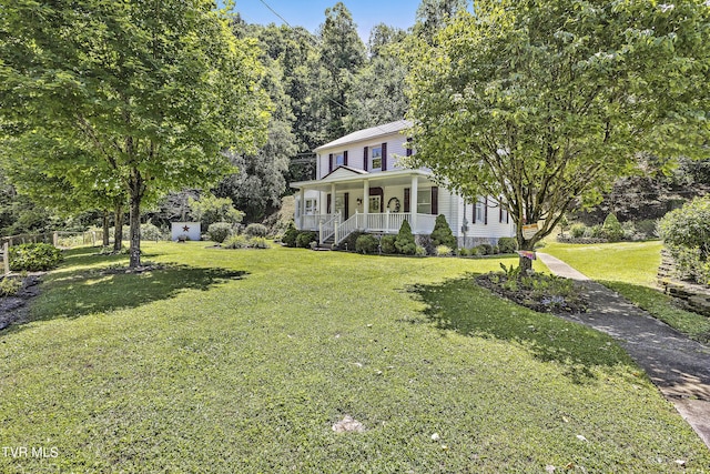 view of front facade with covered porch and a front lawn