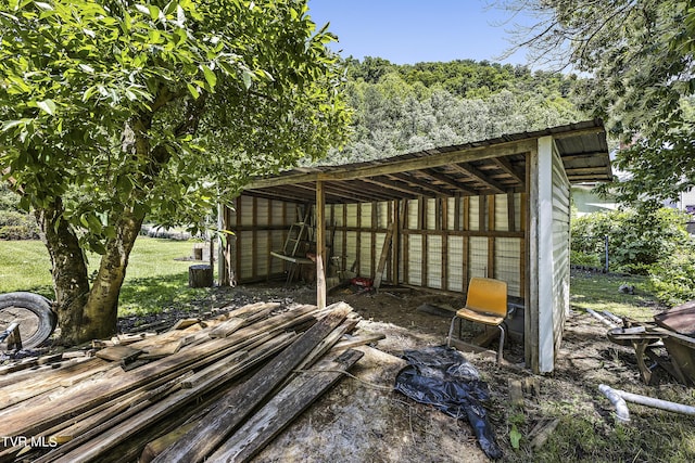 view of patio with an outbuilding